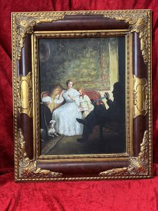 20th Century Fine Art Victorian Wool Winding Interior Scene Circa - 1920 Composition - Oil On Board Listing Description Feminine Artwork Of Wool Winding Scene Set In Victorian Era. Mother And Daughter Sit Upon Balloon Back Lounge Chair, A Male?Father Figure Sits In Shadowed Silhouette Facing Them. The Lady Gracefully Winds The Wool From Gentleman Holding Looped Yarns Into A Neat Ball, Whilst The Dog Looks To Pounce. The Young Female Sits Gazing Down At A Book. Stunning Scene Set In Beautiful Interior, Both Female Figures Eliminated From Day Lit Window. A Fabulous Collectors Artwork Set Inside Ornate Tortoise Shell Style Frame. Unsigned. Dimensions In Cms Height 56cm X Width 46.5cm