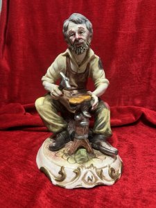 The Cobbler/ Shoe Maker Italian Capodimonte Porcelain Figurine Circa - 1970 Composition - Hard Paste Porcelain Listing Description Authentic Vintage Capodimonte The Cobbler, Stamped By Foundry. Dimensions in Cms Height 29cm X Width 20cm X Depth 22cm