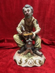 The Cobbler/ Shoe Maker Italian Capodimonte Porcelain Figurine Circa - 1970 Composition - Hard Paste Porcelain Listing Description Authentic Vintage Capodimonte The Cobbler, Stamped By Foundry. Dimensions in Cms Height 29cm X Width 20cm X Depth 22cm