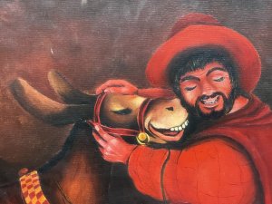 20th Century Fine Art Martin Trainer Oil Painting Of Matador With Mule Circa - 20th Century Composition - Oil On Board Listing Description Charming Stylised Artwork Of Matador And Mule By Known Artist MARTIN TRAINER. The Central Focal Point of The Painting Depicts A Smiling Matador Wearing Red Hat And Cape. Kneels On Wooden Step Adjusting His Mules Bridal. A Bottle of Liquor Hangs From His Waist Belt. Happy Mule In Riding Tack With Checkered Band Stands Next To His Owner. Eary Backdrop With Auburn Moon Illuminating Buildings In Dark Silhouette. Fine Quality Artwork Painted On Board And Set In Glazed Wood Frame. Dimensions In Inches Height 21" X Width 26"