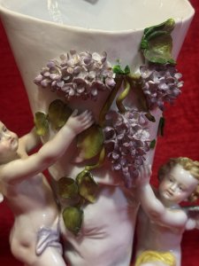 Antique Dresden Porcelain Cherub & Wisteria Decorative Vase Circa - 19th Century Composition - Porcelain Listing Description Rare 19th Century Wisteria And Winged Cherub Ornamental Vase. Fine Detail With Hand Sculpted Cherubs Holding Up Cornucopia Shaped Flower Urn Decorated With Wisteria Vines. Dresden Foundry Mark On Base. Dimensions In Cms Height 28cm X Width 18cm at Base Mouth Opening 12cm x 10cm
