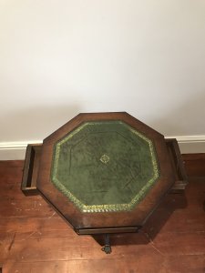 Regency Style Hexagonal Centre Table With Tooled Green Leather Top For Writing Two Drawers With Brass Handles Regency Style Tripod Legs With Brass Claw Feet With Castors Stunning Red Walnut With Beautiful Patina Lovely Condition Useful Piece Dimensions In Inches Height 23.5” Width 19.25” Depth 19.25”