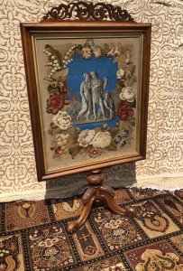 Stunning Museum Quality Fire Screen In Burl Walnut Decorated With Roman Figures In Beadwork And Wool Work Classical Roman Three Figures In A Corn Field Depicting Harvest Time In Rome Artwork In Glass Beads Which Forms The Central Picture Surrounded By Stunning Roses And Floral Foliage Boarder In Wool Work Deep Bright Colours Carved Fretwork Top In Burl Walnut To Match The Frame Silk Damask Back Panel With Brass Studs Stunning Tripod Cabriole Legs Victorian Circa 1880 Beautiful Original Condition Dimensions In Inches Height 53” Width 30”