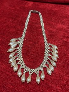 Antique Art Deco Teardrop and Seed Pearl Necklace With Silver Clasp Circa - 1920 Composition - Seed And Tear Drop Shaped Pearls Listing Description Stunning Feminine Antique Pearl Necklace Which Falls Into Teardrop Pearls Around Chest Line. Fair Condition Showing Signs of Wear Due to Age. Hangs 22cm In Length From Clasp When Closed.