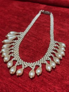 Antique Art Deco Teardrop and Seed Pearl Necklace With Silver Clasp Circa - 1920 Composition - Seed And Tear Drop Shaped Pearls Listing Description Stunning Feminine Antique Pearl Necklace Which Falls Into Teardrop Pearls Around Chest Line. Fair Condition Showing Signs of Wear Due to Age. Hangs 22cm In Length From Clasp When Closed.