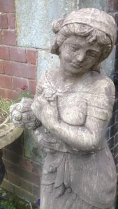 Wheat Maiden Statue In The Regency Style Upon A Round Corinthian Plinth. Elegant Lady Holding A Shelf Of Wheat Stunning Tall Statue Stand Upon A Round Fluted Corinthian Plinth Reconstituted Stone Purchased From Manor House In Lisguard Cornwall Weight Approx 60kg Lifts Off Plinth Dimensions In Inches Total Height 52 1/4” Statue Height 39” Width 12” Depth 8.5” Circular Plinth Base Height 13 1/4” Width 11”
