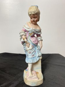 Rare Pair Of French Bisque Figurines The Prince And Princess With The Glass Slipper Circa - Vintage Composition - Bisque Hard Paste Porcelain Listing Description Beautiful Pair Of French Young Royal Male & Female Figurines. The Young Prince (Prince Charming) In Pale Blue/ Pink Tail Coat With Elaborate Neck Ruffle, Hand Painted Floral Sprays And Yellow 3/4 Pantaloons Holds A Ladies Slipper. The Young Lady (Cinderella) Wears Beautiful Pale Pink Corseted Bustier Dress With Full Skirt In Pale Blue Holding Her Foot Upon A Cushion Waiting To Try On The Slipper The Prince Is Holding. Stunning Facial Details And Attention To Detail. Condition - Vintage Used Minor Cracks To Porcelain Visible Please See Images, Wear To Pastel Glaze In Smem Parts Due To Age And Usage. Dimensions In Inches Height 12" Width 4.5" Depth 4"