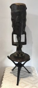 Rare Antique Carved Wood Fertility Drum Of African Tribal Woman . Circa 1890 African Tribes Use The Tribal Drum For A Tribal Dance To Celebrate Pregnancy Calf Hide Skin Top Supported By African Woman’s Head And Arms With Carved Fish & Serpents Adorning The Drum Interesting Facial Features And Body Comes Complete With Intertwined Tripod Leg Table Base With Carved Elephant And Rhino Top Museum Quality Very Interesting Items Provenance Part Of Lord Hill Museum Collection Dimensions In Inches Drum Height Drum Width Table Height Table Width