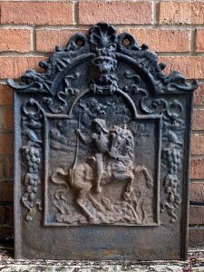 Museum Grade Edward III Rare Cast Iron Fire Back Plate With Basket Grate. Circa -1490 Composition- Cast Iron Rare Historic Ornate Artwork Fire Back Plate Thought To Be From Bodium Castle, East Sussex, England. Depicting King Edward III Upon Horse Back With Roaring Lion Motif Top And Decorative Grape Vines. The Cast Iron Log Basket Grate Is Not Original To Back Plate But Complements With Practically. Dimensions In Inches Back Plate Central Height 27” X Width 21 1/4” X Depth 1 1/4” Basket Grate Height 9” X Width 19” X Depth 11”