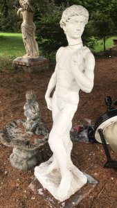 Roman Male Statue In Classical Pose Italian Style Tall And Handsome Composition- Weathered Reconstituted Stone Dimensions In Inches Height 46” Width 16” Depth 15”