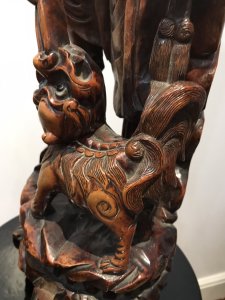 Late 19th Century Oriental Chinese Foo Man Sculpture Carved In Fruitwood Chinese Huntsman With Foo Dog Standing Upon Plinth With 4 Carved Feet Both With Glass Radiant Eyes Amazing Quality And Detail Exceptionally Well Executed Hand Carving Out Of One Piece Of Rare Wood Unsigned Collectors Item Circa - 1875 Dimensions In Inches Height 23” Width 9” Weight Approx 10kg