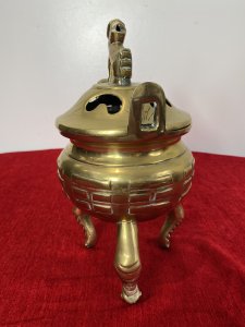 Chinese Qing Style 19th Century Insense Burner With Foo Dog Lid. Bulbous Shaped Incense Pot With Geometric Shaped Decoration Stands Upon Crab Like Tripod Legs. Loop Handles And Heavy Lid With Smoke Holes And Foo Dog Pinnacle With A Hole Mouth For Incense Smoke Deploy. Beautiful Quality Incense Burner In Unusual Form. Unsigned. Quality Collectors Piece. Dimensions In Inches Height 10” Width 5 1/4 “
