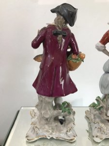 Pair Of 18th Century Style Chelsea Figurines. Lady And A Gentleman Gathering Fruit And Game Standing On Shaped Gilded Plinths. Painted In Bright Hues. The Detail On These Figurines Is Breathtaking. Chelsea Markings On The Bases. Slight Damage On The Gentleman’s Forefinger. Provenance: Purchased From The Lord Hill Museum Shropshire. Dimensions In Inches. Height 7 1/4”. Base 3” Square
