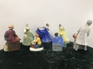 Amazing Collection Of Royal Doulton 7 Figurines Signed And Numbered. Royal Dolton 1 - Girl Evacuee (Girl With Teddy) No 1511 2- Child Hood Days (Boy With Dog) No HN 2967 3- Tuppence A Bag (Lady Feeding Pigeons Mary Poppins Reference) No HN 2320 4- Thanks Doc ( Vet With Dog) No 2721 5- Fair Lady (Dancing Girl Green Gown) No HN 2193 6- Elaine (Dancing Girl Blue Gown With Fan) No HN 2793 7- Paula ( Dancing Girl Yellow Gown) No HN 2906 Rare Items Amazing Collection Of Royal Dolton Figurines 7 Items In The Collection 1970’s Models All Signed And Numbered Sold As A Collection From Lords Hill Museum All Perfect Condition A Very Interesting Lot