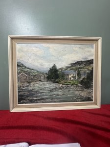 20th Century Fine Art Barbara Butcher 'The River Beddgelert' Oil Painting Circa -20th Century Composition - Oil On Canvas Listing Description Fine Quality Oil Painting By Known Artist Barbara Butcher Showcasing Picturesque Riverbank Scene Titled 'The River Beddgelert' This Refers To The Confluence Of Both Afon Glaslyn Which Flows Through The Village Of Beddgelert, And Is Joined By Afon Colony At This Point Shown In The Painting. Exceptionally Skilled Painting Of Welsh Village, Detailed Stone Houses And Rock Filled River Gorge. A Must Have For Art Lover Of Welsh Heritage Scenes. Dimensions in Cms Height 53.5cm X Width 66cm For Further Information Please Call Our Museum Curator On 07707 488566 Thank-you.