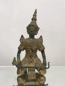 Exceptional 19th Century Gilt Bronze Meditation Pose Buddha In Fine Detail Buddha Bronze With Detailed Facial Features With Intricate Pattern And Floral Motifs Over The Gilt Clothing. Tall Hat And And Shaped Shoulders Buddha Holds A Crop In Lovely Unusual Kneeling Meditation Pose Original Condition With Lovely Patina Origin- India Provenance Purchased From USA Collection Dimensions In Inches Height 7” Width 3 3/4” Weight Approx 1Kg