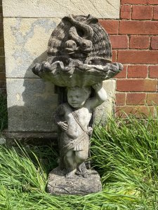 Classical Cherub Holding Scallop Shell Basin With Dolphins Bird Bath. Circa - Vintage Composition- Reconstituted Stone Condition- Used Original Weathered Beautifully Detailed Cherub Stands Against Scrolled Column Carefully Balancing A Scallop Shell Basin Above His Head With Ornamental Dolphins Fountain Design. Refined Facial Features With Eloquent Hands. An Exceptional Vintage Piece Inspired By French 18th Century Architecture. Stunning Garden Feature For Attracting Birds And Wildlife. Heavy Item. Provenance Purchased From 18th Century Stately Home Walled Market Garden, Derby. Dimensions In Cms Height 86cm Width 42cm Depth 29cm