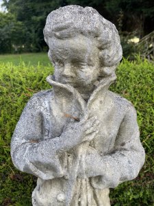Classical Young Georgian Aristocrat Nobleman Garden Sculpture. Young Aristocratic Gentleman In The Georgian Style Wears Long Buttoned Coat, Shorts And Laced Up Boots. The Young Male Holding Coat Closed At The Top Make Him Look Mischievous. Beautifully Sculpted Fabric Movement. Lovely Facial Details. Vintage Piece. Dimensions In Inches Height 28” Width 10” Depth 9” Weight Approx 40KG