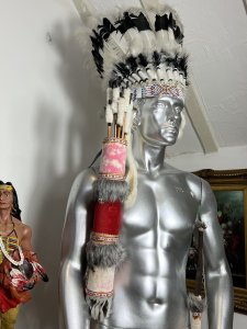 Mesmerising Collection Of Native American ' Big Chief Sitting Bull' Memorabilia Circa - Vintage Composition - Mixed Materials *Head Dress - Calf Skin, Axe Figure - Resin, Bow & Arrows - Wood Mixed Media, Tipi - Wood & Resin Figures, Paintin - Velvet Canvas Wood Frame.* Listing Description Thought Provoking Collection Of Native American Big Chief Sitting Bull Memorabilia. Six Piece Set Includes Warbonnet Head Dress In Calf Skin With Decorative Beaded Edge, Animal Pelts And Large Plumes Of Feathers. Indian Chief Painting On Velvet Set In Ornate Carved Wood Frame. A Decorative String Bow With Carved Wood Chief Handle And String Line, Matching Decorated Cylindrical Holster With Wood Arrows (Bow And Arrows For Decoration Only). An Interesting Wooden Tipi Sculpture With Internal Sitting Chief And Squaw With Holster Of Arrows, A Charming Peeping Hole In The Back Of Tipi Gives it Great Interest. Large Native Indian Figure With Axe In Tradition Native Clothing. * Native Indian With Bow Figurine not Included With Set * Wonderful Set For Collector Of Tribal Memorabilia Or Use As Props. Provenance Purchased From Avid Collector Of Chief Sitting Bull Memorabilia, And Now Part Of Private Lord Hill Museum Collectoion. Dimensions in Inches Painting Height 22 3/4 X Width 18 3/4 Tipi Height Height 13 1\4 X Width 10.5" X Depth 5 1/4 Axe Figure Height 24" X Width 12" X Depth 14" Bow Height 53" X Width 8" X Depth 2" Arrows Height 26" X Width 8" x Depth 2" Warbonnet Head Dress Height 31" X Width 23" X Depth 16"