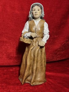 Charming Studio Pottery Figurine 'Lady Holding Egg Basket' Sculpture Circa - Vintage Composition - Ceramic/ Clay Listing Description Beautiful Collectors Studio Pottery Figuring Depicting Lady In Powder Blue Headscarf Holding Basket Laden With Eggs. Hand Crafted Pottery Intricately Detailed Sculpture. Astonishingly Sculpted Facial Features And Beautifully Crafted Hands Holding Wicker Egg Basket, Wearing Two Piece Botton Front Waistcoat With Matching Floor Length Skirt And Glossy Broderie Anglaise Shirt. Unsigned Dimensions In Inches Height 17" X Width 7" x Depth 7" For Further Information Please Call 07376 618513 Thank-you