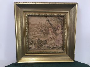 Fine Reproduction 18th Century Style French Figures Tapestry Set In French Chateau Garden Beautifully Gowned Mother And Child And The Father Kneeling Recovering His Hat From The Stream With A Stick Charming Subject Silk Work Tapestry Fine Detail Set In Stunning Gilt Wood Frame Dimensions In Inches Height 14” Width 14”
