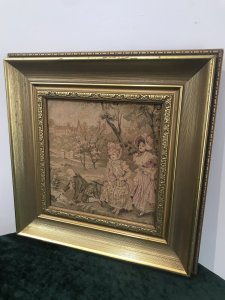Fine Reproduction 18th Century Style French Figures Tapestry Set In French Chateau Garden Beautifully Gowned Mother And Child And The Father Kneeling Recovering His Hat From The Stream With A Stick Charming Subject Silk Work Tapestry Fine Detail Set In Stunning Gilt Wood Frame Dimensions In Inches Height 14” Width 14”