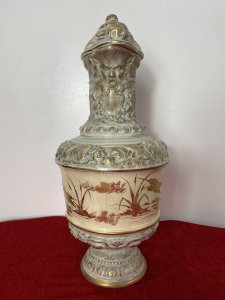 French Antique Classical Wine Ewer Decorated With Gilt Mural Of Herons. Circa ~ 1890 Large Pale Blue Ewer Urn Decorated In Grape Vines With Gilt Painted Mural Of Flying Herons With Salt Reeds Around The Centre. Beautifully Ornate Gilt Rams Head Handle With Masked Head Spout And Stunning Unusual Hogs Head Lid. Sits Upon Gilt Circular Base With Symmetrical Bulbous Floral Patternation. No Makers Mark But Stunning Details Quality Museum Grade Piece. Condition- Antique Used Small Top Pinnacle Seems To Be Missing From Lid Top. Otherwise Beautiful Condition Shows Signs Of Age In The Glaze Conducive To Age And Usage. Provenance Part Of Large Paris Private Collectors Exhibition. Now Showcased At Lord Hill Museums Extensive Collection. Dimensions In Inches Height 18.5” Width Widest Point 8” Weight Approx 8Kg