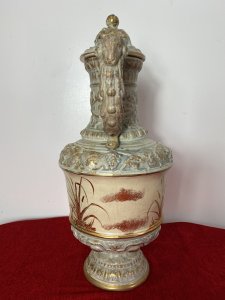 French Antique Classical Wine Ewer Decorated With Gilt Mural Of Herons. Circa ~ 1890 Large Pale Blue Ewer Urn Decorated In Grape Vines With Gilt Painted Mural Of Flying Herons With Salt Reeds Around The Centre. Beautifully Ornate Gilt Rams Head Handle With Masked Head Spout And Stunning Unusual Hogs Head Lid. Sits Upon Gilt Circular Base With Symmetrical Bulbous Floral Patternation. No Makers Mark But Stunning Details Quality Museum Grade Piece. Condition- Antique Used Small Top Pinnacle Seems To Be Missing From Lid Top. Otherwise Beautiful Condition Shows Signs Of Age In The Glaze Conducive To Age And Usage. Provenance Part Of Large Paris Private Collectors Exhibition. Now Showcased At Lord Hill Museums Extensive Collection. Dimensions In Inches Height 18.5” Width Widest Point 8” Weight Approx 8Kg