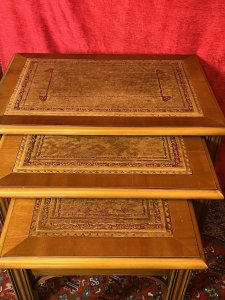Chippendale Style Elmwood Trio Of Nesting Tables With Tan Leather Tops Circa - Vintage Composition - Solid Elmwood With Leather Tops Listing Description Chippendale Style Set Of Three Elmwood Rectangular Nesting Tables With Tan Tooled Leather Tops. Resting On Ornate Carved Corner Brackets And Set Upon Reeded Legs. Stunning Honey Elmwood Colouration With Polished Patina. Quality Usable Trio For Lounge, Office, Living Area Or Study. Dimensions In Inches Height 20 3/4" X Width 22" X Depth 15.5" For Further Information Please Call 07376 618513 Thank-you