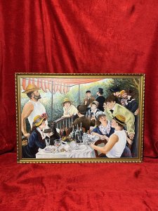 Fine Art Impressionist Artwork 'Luncheon Of The Boating Party' After Pierre-Auguste Renoir By John Wickens Circa - Dated 1971 Composition - Oil On Board Listing Description Finely Painted Reproduction Of Master Artwork After Pierre-Auguste Renoir Titled; Le Déjeuner des canotiers/ Luncheon Of The Boating Party. The Original Artwork By Pierre- Auguste Renoir Is Now Part Of The Phillips Collection In Washington D.C. The Painting Combines Figures, Still Life And Landscape In One Work And Depicts Renoirs Friends Relaxing On A Balcony At The Maison Fournaise Restaurant Along The Seine River In Chatou, France. A Total Of 14 Figures Amongst The Composition. The Painter Gustave Caillebotte, Is Seated Lower Right Conversing With Actress Angèle Legault And Italian Journalist Adrien Maggiolo. Renoir's At The Time Future Wife, Aline Charigot, Sits Opposite Playing With A Affenpincher Dog. She Replaced An Earlier Woman Who Sat For The Painting But With Whom Renoir Became Annoyed.The Table Is Abundantly Filled, A Fruit Stand In The Centre, Various Opaque Wine Bottles Behind, With Surrounding Wine Glasses At Various Drinking Stages. Actress And Model Ellen Andrée Note As The Woman With The Glass Stands Out In The Centre Of The Painting. Far Back In The Top Hat, Is noted Art Collector And Historian Charles Ephrussi. He Is Speaking With Poet Jules Laforgue. To The Right , Renoir's Friends Eugène Pierre Lestringuez And Paul Lhote Are Presented Flirting With Renowned Actress Jeanne Samary. The Original Artwork Was Debuted in 1882 At The Seventh Impressionist Exhibition, Where Three Critics Singled It Out As Best Piece In The Show. This Attributed Artwork Which Although A Copy Of The Fine Master Artwork, Is No Less Breath-Taking, A Real Showpiece. Painted By An Accomplished Hand In Vibrant Colour With Exceptional Skill And Flare. Signed By Artist John Wickens (1971) With Written Attribution To Renoir By Artist. Dimensions In Inches Height 19.5 X Width 27.5