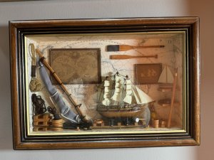 Vintage Maritime Nautical Sailing Ships Chandler Diorama/Shadowbox Circa - Vintage Composition - Wood/ Mixed Media Listing Description Wonderful Quality Detailed Sailing Ships Chandler Diorama Wall Hanging. Glazed Wooden Shadowbox With Wood Frame Showcasing A Backdrop Of World Map With Hanging Pictures Of Sailing Ship, Map Of The World And Wood Paddles. Central Large Sailing Ship Model Set Upon Blocks, With Surrounding Life Ring, Hammer, Bucket And Lantern. To The Right Side Of Model Is Shelving With Various Ship Model And Left Side Of Model Large Resting Ships Sail, Bucket Of Rope And Hanging Rope Buoy. Interesting Handmade Collectors Item. Dimensions In CMS Height 30cm X Width 35cm X Depth 6.5cm For Further Information Please Call The Museum Curator On 07707 488566 Thank-you.