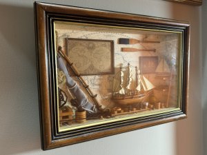 Vintage Maritime Nautical Sailing Ships Chandler Diorama/Shadowbox Circa - Vintage Composition - Wood/ Mixed Media Listing Description Wonderful Quality Detailed Sailing Ships Chandler Diorama Wall Hanging. Glazed Wooden Shadowbox With Wood Frame Showcasing A Backdrop Of World Map With Hanging Pictures Of Sailing Ship, Map Of The World And Wood Paddles. Central Large Sailing Ship Model Set Upon Blocks, With Surrounding Life Ring, Hammer, Bucket And Lantern. To The Right Side Of Model Is Shelving With Various Ship Model And Left Side Of Model Large Resting Ships Sail, Bucket Of Rope And Hanging Rope Buoy. Interesting Handmade Collectors Item. Dimensions In CMS Height 30cm X Width 35cm X Depth 6.5cm For Further Information Please Call The Museum Curator On 07707 488566 Thank-you.