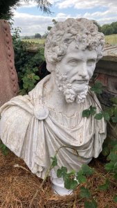Classical Bust Of Roman Emperor Antioninus Pius Circa - 1890 Composition - Resin Shell / Reconstituted Stone Inner. Listing Description This Is The Main Portrait Type And The Official Portrait Of The Emperor Throughout His Reign (AD 138-161). The Bust Shows The Emperor As A Mature Man With Distinct Facial Features, With A Full Neatly Trimmed Beared And Thick Curley Hair. Antoninus Wears A Tunic,A Cuirass (Body Armour), And A Fringed Plaudamentum (A Generals Cloak) Folded In Half And Pinned At His Right Shoulder. Antoninus Born In Lanuvium To A Family That Had Migrated To Italy From Nemausus In Southern Gaul (Today Nǐmes In France). Antoninus Was Not Groomed To Become Emperor. At The Advanced Age Of 51, Following A Career As Governor Of The Province Of Asia And As Roman Senator, He Was Adopted By Emperor Hadrian To Be His Successor. Antoninus Long And Extremely Peaceful Reign Brought Great Prosperity To The Roman Empire, And The Economy, Culture, And Artistic Production Flourished. The Emperor Started The Dynasty Of The Antonines, Which Lasted For More Than Two Generations And Ended With The Death Of Commodus In AD 192. The Bust Of Antoninus Provides A Firmly Dated Visual Reference For What Characterised Roman Aesthetics During The Period. The Original Bust Carved In Solid Marble Was Acquired In Naples, Italy In 1851 By Robert Martin Berkeley (1823-1819) Who Brought It To His Estate In Spetchley Park, Worcestershire, England. It Remained Their Until It Was Offered At Auction At Sotheby’s London Late Last Year (2024). Although Documented In Estate Archives The Bust Was Previously Unknown To The Public And Scholars. Dimensions In Inches Height 36” x Width 24” x Depth 12” Weight Approx. 45KG For Further Information Please Call Our Museum Curator On 07707 488566 Thank-you.