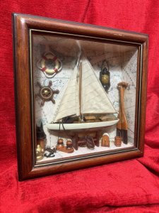 CHARMING VINTAGE SAILING BOAT MARINE DIORAMA IN DISPLAY CASE Circa - 1980 Composition - Wood And Mixed Media Listing Description Wonderful Vintage Sail Boat Diorama Model Set Inside Glazed Mahogany Wood Frame. A Large Wooden Sail Boat Centre Of Display With Fabric Sails And Metal Anchor On Looped Chain. Intricate Background Of Antique Atlas Pages With Ornamental Wall Hangings Of Captains Oil Lamp, Life Ring, Ships Wheel Hanging As Wall Display. The Floor Display Of The Diorama Is Laden With Nautical Goodies including Wooden Sail Paddles, Bucket, An Abundance Of Rope And Rope Holders, Mooring Posts And Rope Hooking Pole. A Spectacular Model For Marine Enthusiasts. Dimensions in Cms Height 30cm x Width 30cm x Depth 8cm For Further Information Kindly Message Or Call The Museum Curator Leslie On 07707 488566. Thank-you