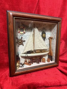 CHARMING VINTAGE SAILING BOAT MARINE DIORAMA IN DISPLAY CASE Circa - 1980 Composition - Wood And Mixed Media Listing Description Wonderful Vintage Sail Boat Diorama Model Set Inside Glazed Mahogany Wood Frame. A Large Wooden Sail Boat Centre Of Display With Fabric Sails And Metal Anchor On Looped Chain. Intricate Background Of Antique Atlas Pages With Ornamental Wall Hangings Of Captains Oil Lamp, Life Ring, Ships Wheel Hanging As Wall Display. The Floor Display Of The Diorama Is Laden With Nautical Goodies including Wooden Sail Paddles, Bucket, An Abundance Of Rope And Rope Holders, Mooring Posts And Rope Hooking Pole. A Spectacular Model For Marine Enthusiasts. Dimensions in Cms Height 30cm x Width 30cm x Depth 8cm For Further Information Kindly Message Or Call The Museum Curator Leslie On 07707 488566. Thank-you
