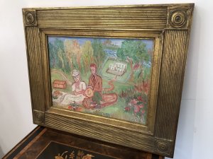 Original Contemporary Oil On Canvas Painting By Shiela Parker Dunbar Walker Landscape With A Man And Woman Having A Picnic With A Bottle Of Wine With A House, Garden And Foliage In The Background Quirky Subject A Type Of Folk Art Wonderful Colour Coordination Set In Ornate Gilt Wood Frame Dated 1970 - 1975 Exhibited In Paris Exhibition Dimensions In Inches Height 19” Width 23” Depth 1”