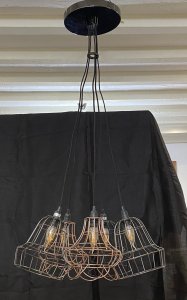 Modernistic Five Bulb With Wirework Shades Saloon Style Chandelier Centrepiece. Circa - 20th Century Composition - Metal Fixture/ Wirework Shades Large Modernistic 5 Bulb Spider Chandelier With Decorative Wirework Shades And Candle Bulbs. Gunmetal Circular Top Mount Ready To Wire In Position. Five Shades In Gunmetal And Bronze Wirework.Can Be Hung As Shown Or Each Wire Can Be Positioned On Ceiling As Spider Fixture. Wiring In Good Order We Advise Pat Testing On Electrical Products Before Use. Dimensions In Inches Hanging Height 43" Chandelier Width As Shown 22"