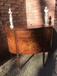 Italianate Marquetry Bow Front Commode With Floral Bouquet Inlays Solid Burl Walnut Bow Front Commode Chest With Fine Veneer Inlays Of Floral Bouquets And Musical Instruments In Olive Wood, Satinwood And Tulip Wood. Two Opening Side Cupboards, Opening Centre Cupboard (2 Doors) And Top Pull Out Draw With Ormolu Mounted Legs And Supports. Stunning Piece In The Style Of Marie Antoinette Paris. Elegant Ladies Boudoir Piece Condition - Lovely Used Please Note This Piece Has Age And Due To Usage Has Minor Scratches And Signs Of Use The Top Pull Out Draw Has A Small Crack In The Inlay On The Right Side Please See Images Dimensions In Inches Height 36 1/4” Width 41.5” Depth 17.5”