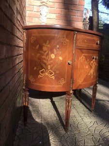 Italianate Marquetry Bow Front Commode With Floral Bouquet Inlays Solid Burl Walnut Bow Front Commode Chest With Fine Veneer Inlays Of Floral Bouquets And Musical Instruments In Olive Wood, Satinwood And Tulip Wood. Two Opening Side Cupboards, Opening Centre Cupboard (2 Doors) And Top Pull Out Draw With Ormolu Mounted Legs And Supports. Stunning Piece In The Style Of Marie Antoinette Paris. Elegant Ladies Boudoir Piece Condition - Lovely Used Please Note This Piece Has Age And Due To Usage Has Minor Scratches And Signs Of Use The Top Pull Out Draw Has A Small Crack In The Inlay On The Right Side Please See Images Dimensions In Inches Height 36 1/4” Width 41.5” Depth 17.5”