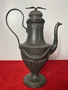 Fine Antique 18th Century KONIGSBERG Germany 3Pc Pewter Coffee Service Circa - 18th Century Composition - Pewter Elegant Fine Quality 3 Piece Pewter Coffee Service By German Makers KONIGSBERG. 3 Piece Set Comprised Of A Large Coffee Pot, Milk Jug And Sugar Bowl. The Tall Coffee Pot Has A Ornemental Dome Topped Lid, Decorated With A Soaring Eagle. The Tapered Neck Leads Into A Urn Shaped Body Decorated With Floral Garlands, Segmented Relief Pattern, Eloquent Curved Carry Handle And Elaborate Spout. The Coffee Pot Stands Upon A Circular Base With Ball And Dart Decoration And Scalloped Edge. The Milk Jug Has Matching Curved Carry Handle, Elevated Pouring Spout, With Swag Of Garlands Around Body & Set On Matching Circular Egg And Dart Base. The Lidded Sugar Bowl Has A Removable Top With Elaborate Dome And Pinnacle, Matching Garland Swags Around The Body With Curved Carry Handle And Pouring Spout. Set Upon Circular Egg And Dart Decorated Stand. Fine Quality Antique Set With All Pieces Stamped Underneath KONIGSBERG Makers Mark. Dimensions In Inches Coffee Pot Height 12" X Width 8.5"X Depth 5" Milk Jug Height 8 1/4" X Width 5 1/4" X Depth 4" Sugar Bowl Height 7.5" X Width 5.5" X Depth 4.5"