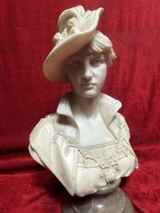 Italian Arnaldo Giannelli Neoclassical Style Lady In Feather Plume Hat Marble Bust Circa - 20th Century Composition - Moulded And Solid Marble Listing Description Fine Quality Marble Bust Depicting A Victorian Lady Of Importance. Beautifully Elegant Faced Female, Wearing High Collar, English Rose Bodice And Ornamental Neck Chain. A Large Side Sitting Hat With Bow And Feather Plume. Bust Sits Upon Red Grained Marble Cylindrical Pediment Base. Large Size & Heavy Item. Dimensions In Cms Height 43cm X Width At Shoulder 26cm X Depth 20cm For Further Information Please Contact The Museum Curator Directly On 07707 488566 Thank-you.