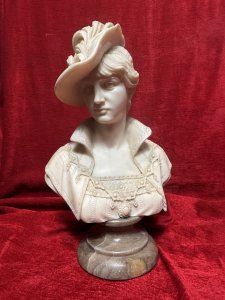 Italian Arnaldo Giannelli Neoclassical Style Lady In Feather Plume Hat Marble Bust Circa - 20th Century Composition - Moulded And Solid Marble Listing Description Fine Quality Marble Bust Depicting A Victorian Lady Of Importance. Beautifully Elegant Faced Female, Wearing High Collar, English Rose Bodice And Ornamental Neck Chain. A Large Side Sitting Hat With Bow And Feather Plume. Bust Sits Upon Red Grained Marble Cylindrical Pediment Base. Large Size & Heavy Item. Dimensions In Cms Height 43cm X Width At Shoulder 26cm X Depth 20cm For Further Information Please Contact The Museum Curator Directly On 07707 488566 Thank-you.