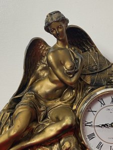 Classical Athena Goddess Of Wisdom Ornate Gilded Mantle Clock W M Widdop Movement Circa - Vintage Composition - Resin Listing Description Ornate Mythological Decorative Mantle Clock Depicting Half Nubile Winged Goddess Of Wisdom And War Athena. Beautifully Posed Female Sitting Perched On A Rock Cluster Holding The Aegis Shield. Stunning Details Of Facial Features, Delicate Hands And Feet With Large Angel Wings In Textural Feathers. Hand Crafted Piece In Resin With Antiqued Guilt Work Finish . Internal W M Widdop Est 1883 Quartz Japanese Movement With Battery Power Source, Requires One AA Battery. Dimensions In Inches Height 40cm Width 46cm Depth 16cm