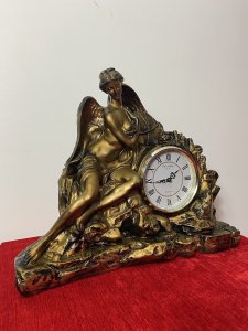 Classical Athena Goddess Of Wisdom Ornate Gilded Mantle Clock W M Widdop Movement Circa - Vintage Composition - Resin Listing Description Ornate Mythological Decorative Mantle Clock Depicting Half Nubile Winged Goddess Of Wisdom And War Athena. Beautifully Posed Female Sitting Perched On A Rock Cluster Holding The Aegis Shield. Stunning Details Of Facial Features, Delicate Hands And Feet With Large Angel Wings In Textural Feathers. Hand Crafted Piece In Resin With Antiqued Guilt Work Finish . Internal W M Widdop Est 1883 Quartz Japanese Movement With Battery Power Source, Requires One AA Battery. Dimensions In Inches Height 40cm Width 46cm Depth 16cm
