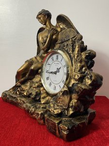 Classical Athena Goddess Of Wisdom Ornate Gilded Mantle Clock W M Widdop Movement Circa - Vintage Composition - Resin Listing Description Ornate Mythological Decorative Mantle Clock Depicting Half Nubile Winged Goddess Of Wisdom And War Athena. Beautifully Posed Female Sitting Perched On A Rock Cluster Holding The Aegis Shield. Stunning Details Of Facial Features, Delicate Hands And Feet With Large Angel Wings In Textural Feathers. Hand Crafted Piece In Resin With Antiqued Guilt Work Finish . Internal W M Widdop Est 1883 Quartz Japanese Movement With Battery Power Source, Requires One AA Battery. Dimensions In Inches Height 40cm Width 46cm Depth 16cm