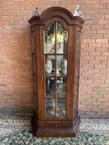 Fine Georgian Style Berger Master Tall Curved Diaplay Cabinet In Solid Elm Wood. Solid Elm Wood Crafted Tall Display Cabinet With Domed Top, Bevelled Glass Panelled Door And Concave Bevelled Glass Side Panels. Bronze Handles. Four Interior Solid Elm Shelves With Mirrored Back For Stunning For Display Of Fine Silver/ Antiques Collection. Beautiful Architectural Stepped Base With Front Pull Out Drawer. Heavy Craftsman Made Piece. Dimensions In Inches Height 77” Width 35” Depth 18” Between Shelf Depth 13