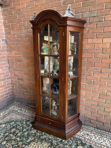 Fine Georgian Style Berger Master Tall Curved Diaplay Cabinet In Solid Elm Wood. Solid Elm Wood Crafted Tall Display Cabinet With Domed Top, Bevelled Glass Panelled Door And Concave Bevelled Glass Side Panels. Bronze Handles. Four Interior Solid Elm Shelves With Mirrored Back For Stunning For Display Of Fine Silver/ Antiques Collection. Beautiful Architectural Stepped Base With Front Pull Out Drawer. Heavy Craftsman Made Piece. Dimensions In Inches Height 77” Width 35” Depth 18” Between Shelf Depth 13