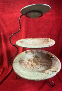 Vintage Mesa Verde Style Hand Painted 3 Tier Fruit Stand With Lizard Motifs. Circa - Vintage Composition- Earthenware / Pottery Colour Way - Blue, Teal, Gold Stunning Three Tier Metal Stand With Elegant Tripod Legs. Complete With Three Diminishing Bowls Hand Painted With Abstract Canyon Style Landscape With Ornate Gilt Lizard Motif On Each Bowl Edge. Exceptionally Decorative Piece For Fruit / Bon Bons Or Floral Display. Strong Mesa Verde National Park Tribal Influence. Dimensions In Inches Height 22” Top Bowl Diam 8” Medium Bowl Diam 11.5” Bottom Bowl 15 3/4”