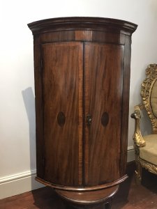 Period Antique 18Th Century George III Corner Cupboard Mahogany Corner Cupboard Cross Banded With Satinwood With Herringbone Inlays And Shell Motifs On The Bow Fronted Doors Ornate Cornice And Shaped Shelves Inside With 3 Oak Lined Drawers Original Lock And Key A Stunning Antique Investment Provenance Purchased From Stately Home In Shropshire Dimensions In Inches Height 42” Width 29” Depth 20.5”