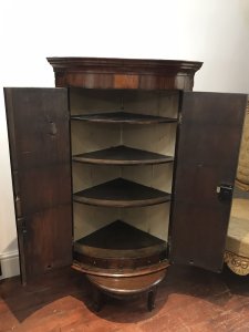 Period Antique 18Th Century George III Corner Cupboard Mahogany Corner Cupboard Cross Banded With Satinwood With Herringbone Inlays And Shell Motifs On The Bow Fronted Doors Ornate Cornice And Shaped Shelves Inside With 3 Oak Lined Drawers Original Lock And Key A Stunning Antique Investment Provenance Purchased From Stately Home In Shropshire Dimensions In Inches Height 42” Width 29” Depth 20.5”